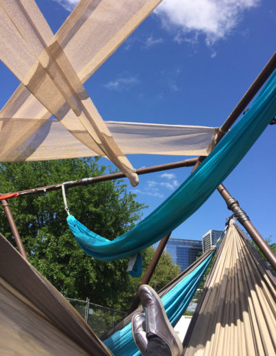 Lounging in one of the hammocks provided on the Art City Austin festival grounds